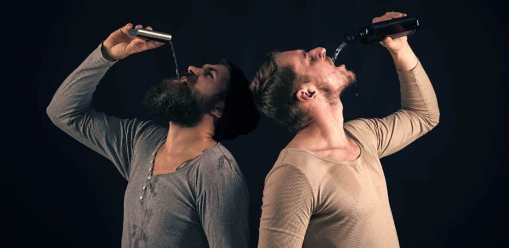 Two different men drinking alcohol from a flask represent the difference between an alcoholic and a problem drinker. 