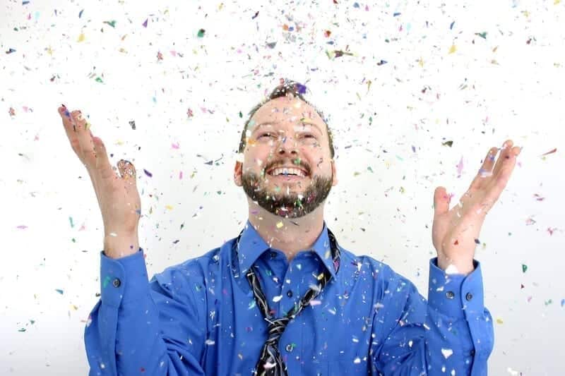 A man celebrating and enjoying a party with substances such as alcohol. 