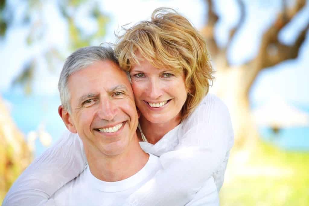 An older couples who are both in sobriety, embrace in the importance of a healthy relationship. 