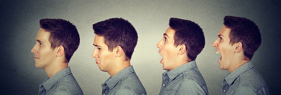 Young man is experiencing various mood swings in early sobriety with a range of emotions from sadness to anger.  