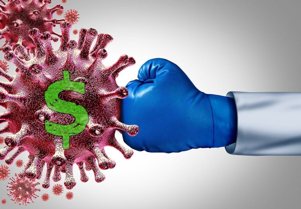 A blue boxing glove is punching a virus represents ways to prevent relapse during covid 19 financial insecurity. 