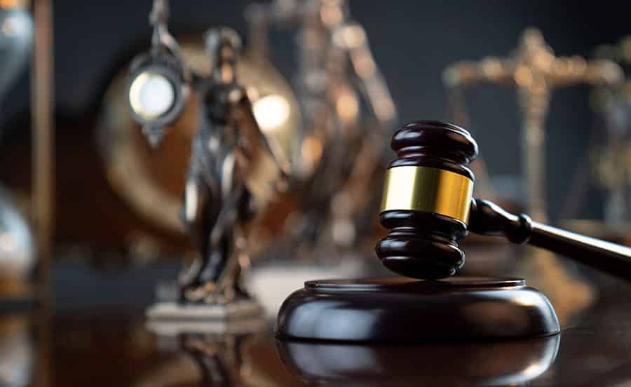 A gavel sits on a judges desk in drug court - showing the difference between incarceration and rehabilitation.