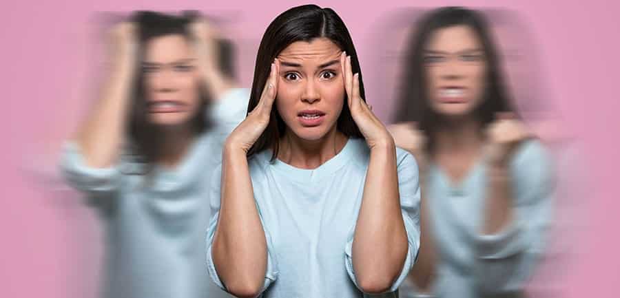 A young woman is experiencing various emotions representing post acute withdrawal syndrome. 
