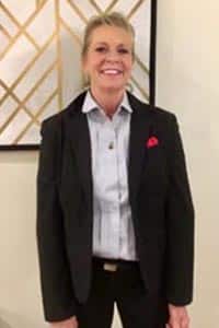 Smiling woman, professionally dressed. Cyndi Jordan, LPN