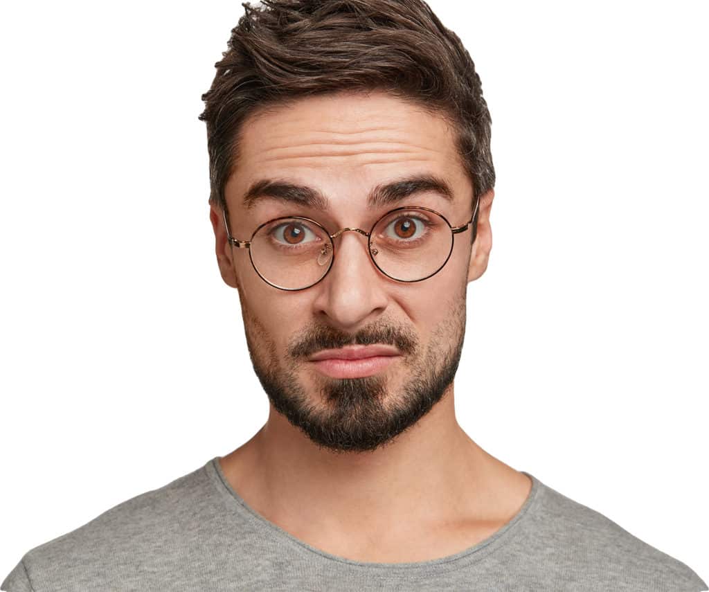 Young guy with glasses looking puzzled with white background