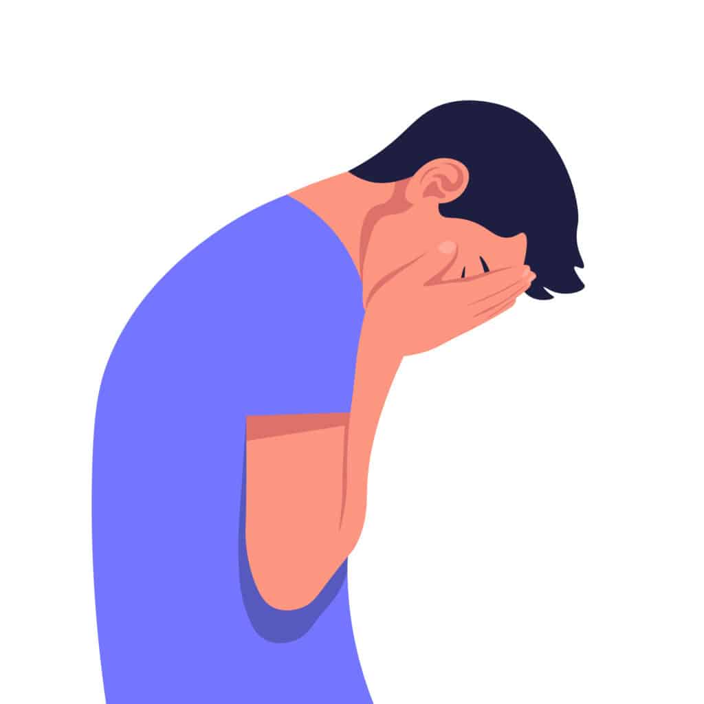 Cartoon of man exhausted from adder all abuse with head in hands
