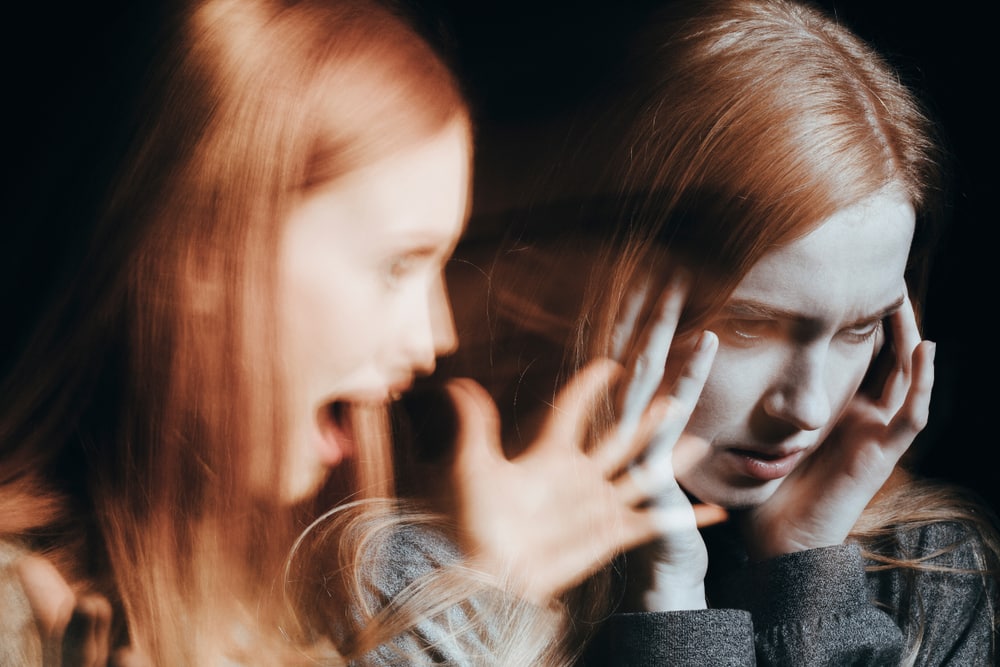 Upset red haired woman in need of kratom rehab with fingers on temples and out of focus same girl screaming next to her