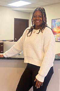 Smiling woman, professionally dressed. Liyah Tyus
Admissions Specialist