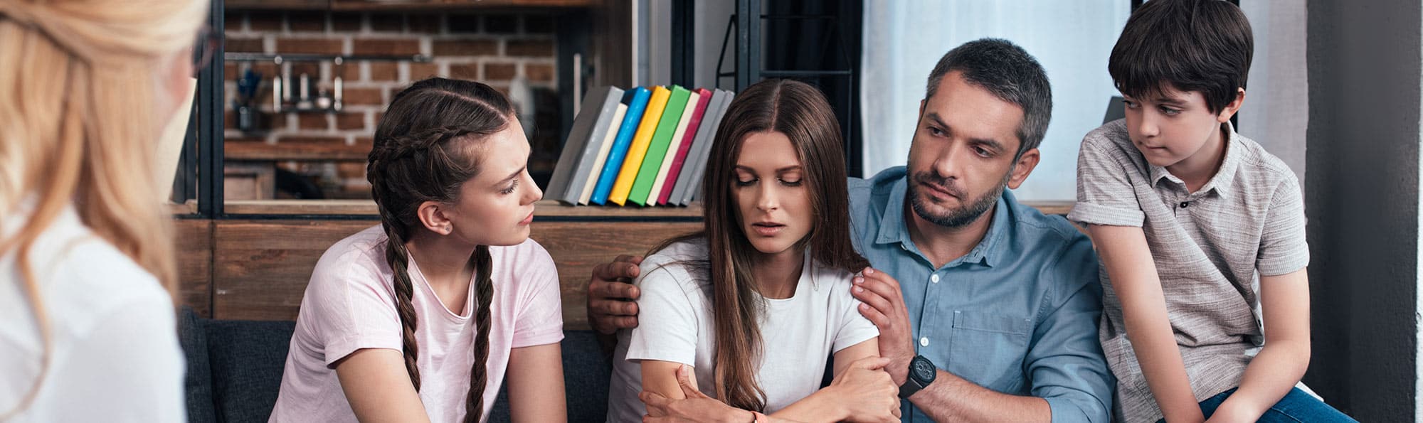 Father with two daughters, one son, and therapist- supporting older daughter through therapy 