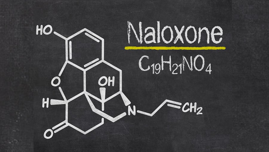 A black background contains a white drawing of the chemical structure of Naloxone, a medication used for opioid use disorder. 