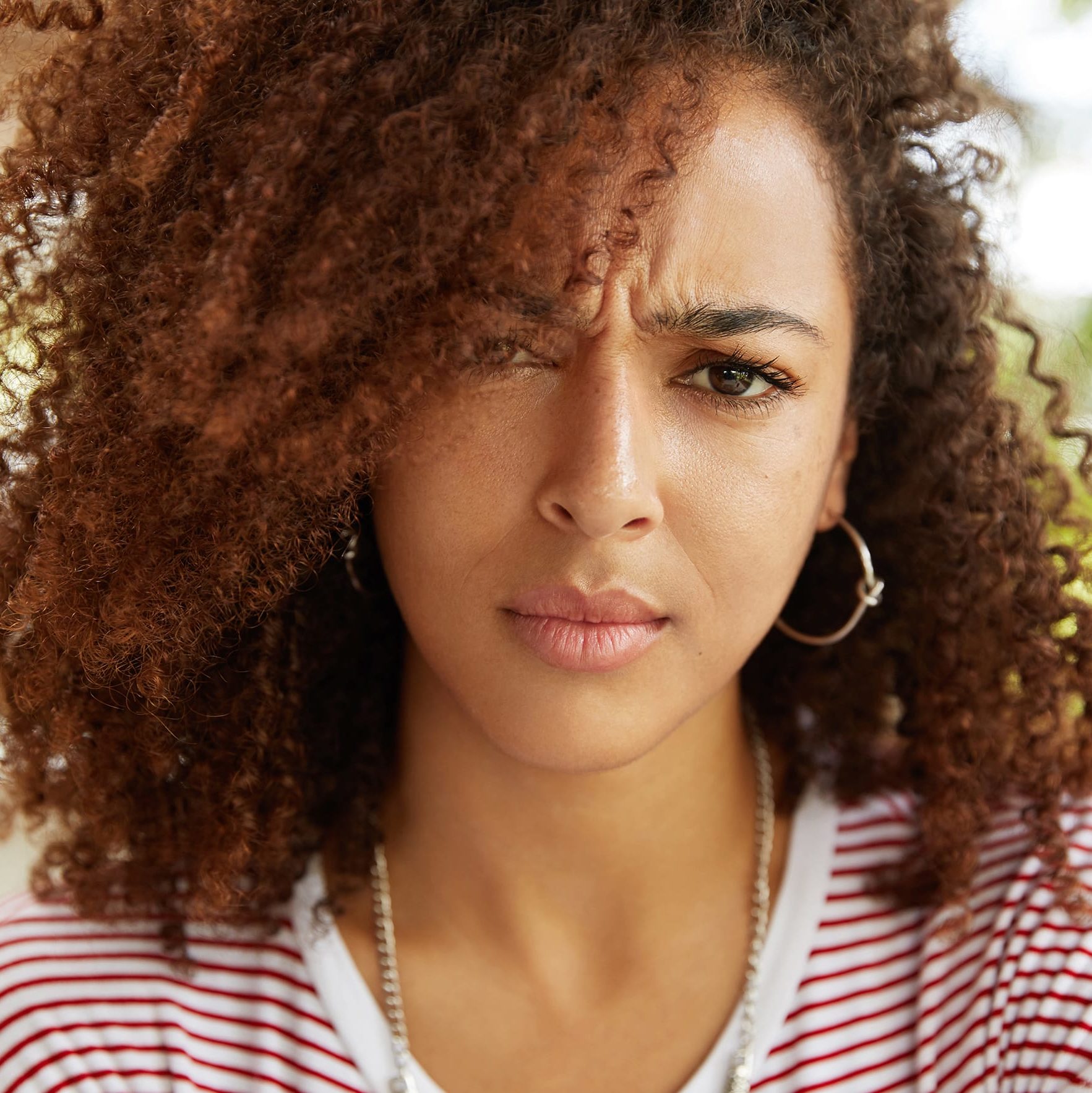 Beautiful portrait of stern, unhappy woman 