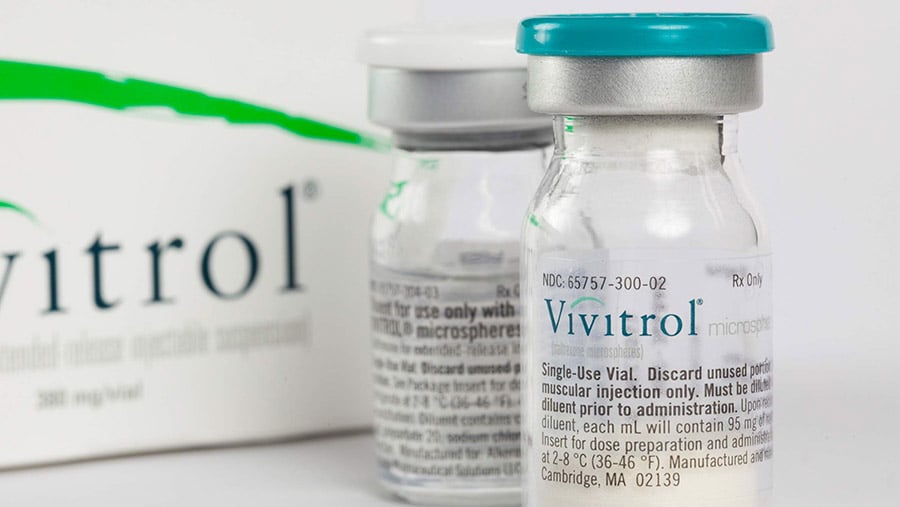 Two clear bottles of Vivitrol represents the effects of Vivitrol and alcohol. 