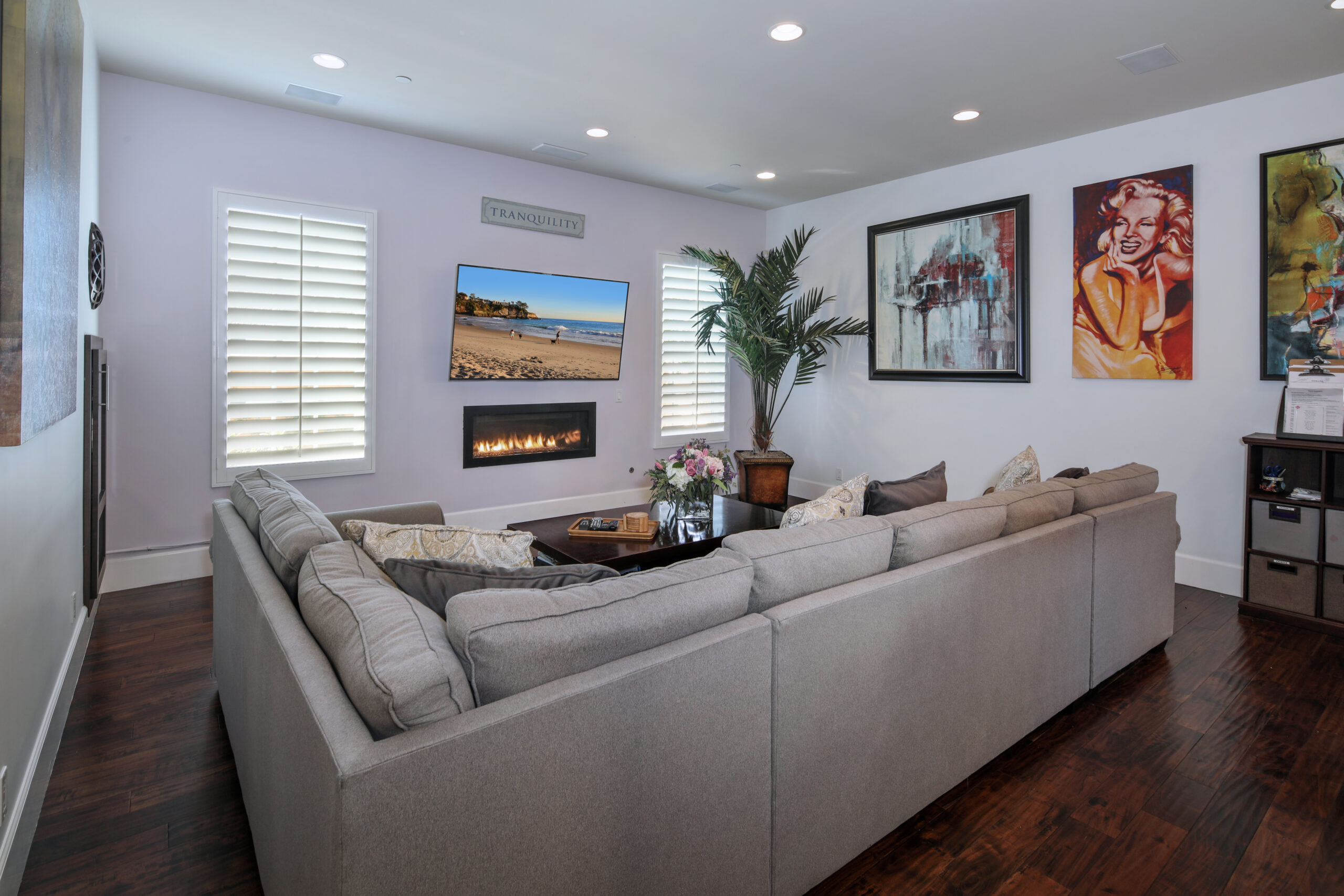 Gray couch with tv and fireplace in an Orange County alcohol rehab