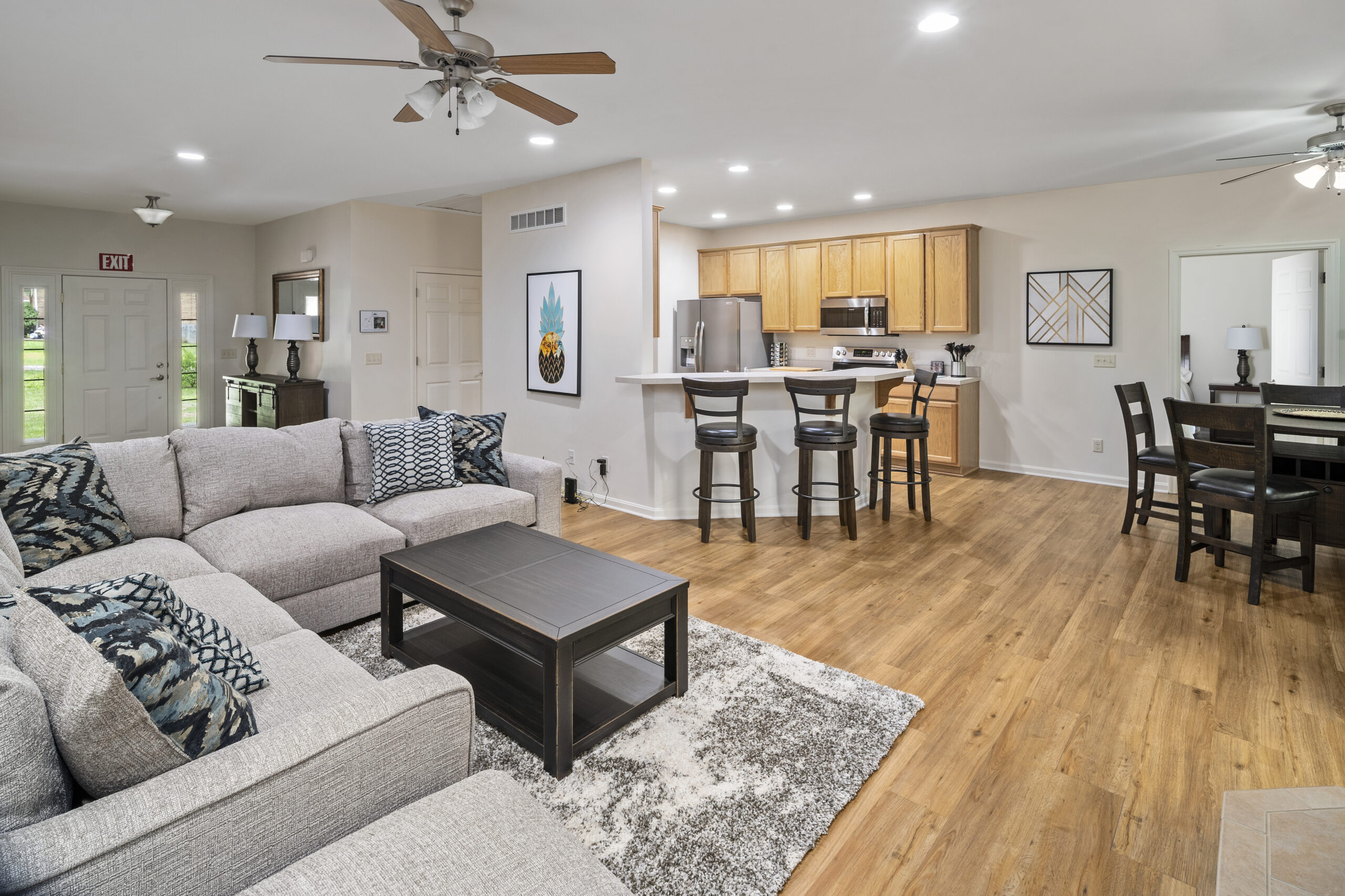 Drug and alcohol rehab in ohio living room with gray couches facing the kitchen area