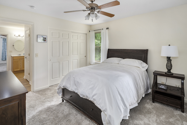 Bed with white comforter and brown bed frame in substance abuse treatment center 