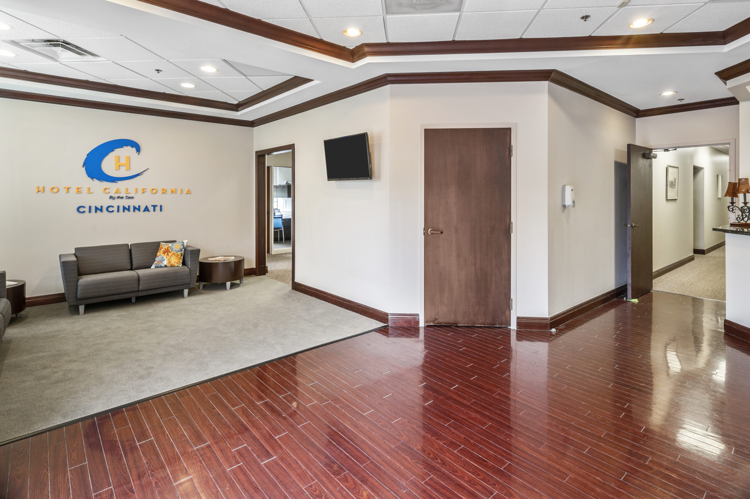 Lobby of Inpatient drug rehab ohio with red oak floors, brown door, and white rug