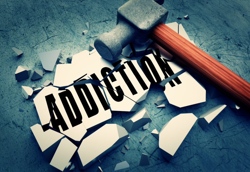Image of the word addiction being smashed by a hammer represents how long it takes to break an addiction.