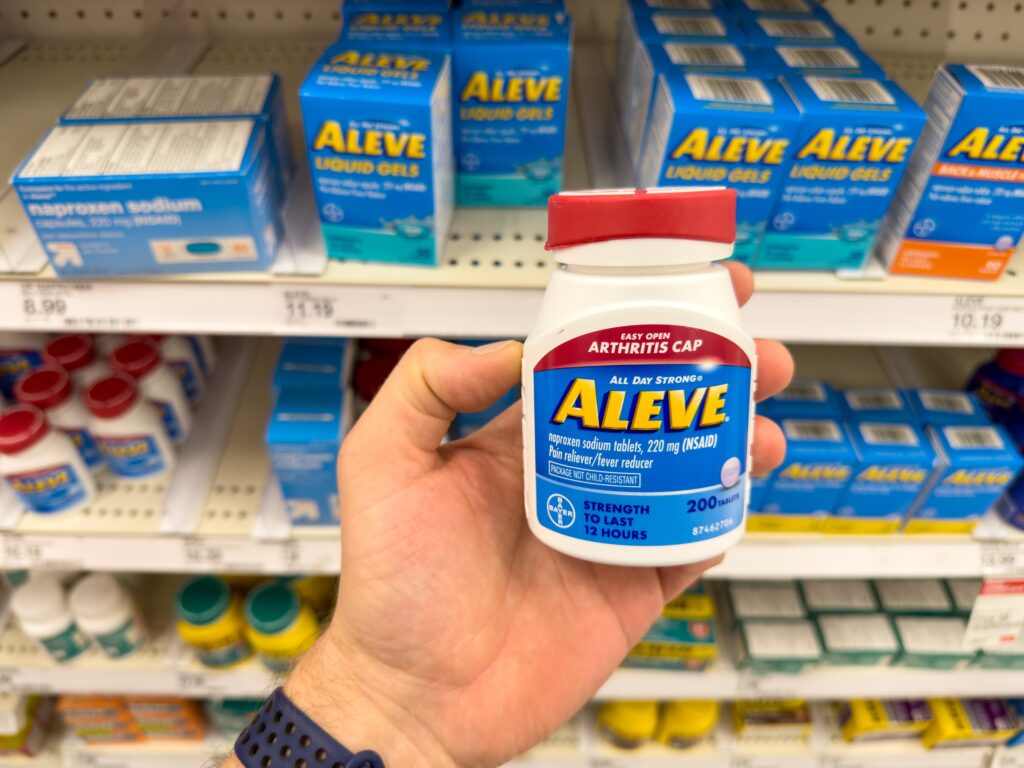 NSAID medication Aleve on the shelf in stores represents if it is safe to take Aleve with alcohol.