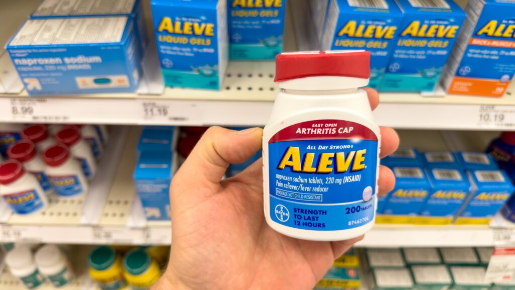 NSAID medication Aleve on the shelf in stores represents if it is safe to take Aleve with alcohol.