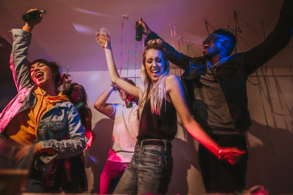 A group of young people partying and drinking lean representing the effects of lean when the drink is being abused.