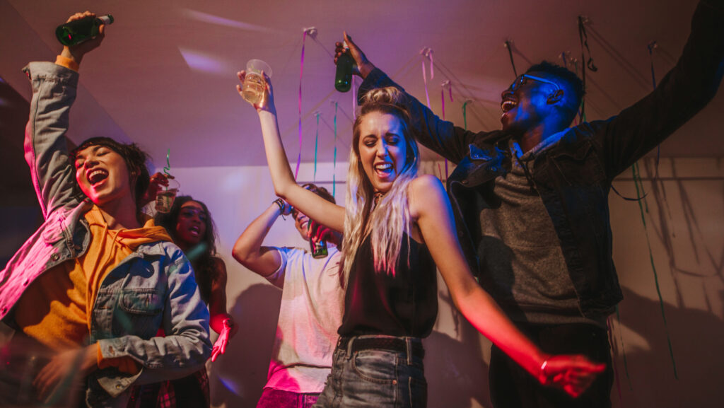 A group of young people partying and drinking lean representing the effects of lean when the drink is being abused.