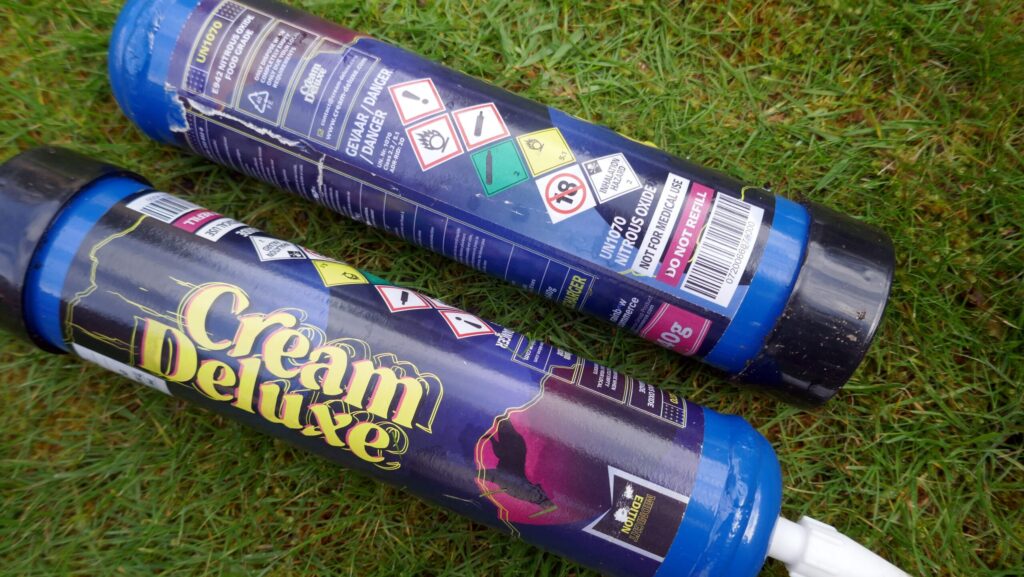 Colorful canisters of whipped cream similar to that of Galaxy Gas.