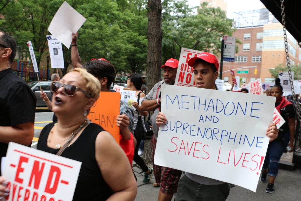 Protesters marching in alliance with methadone treatment despite the potential effects of methadone withdrawal.