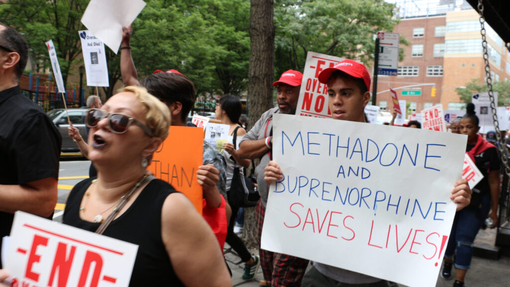 Protesters marching in alliance with methadone treatment despite the potential effects of methadone withdrawal.