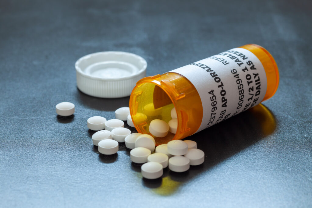 A pharmacy bottle of lorezepam spilled over because it is a pill often used to come off a benzodiazepine.