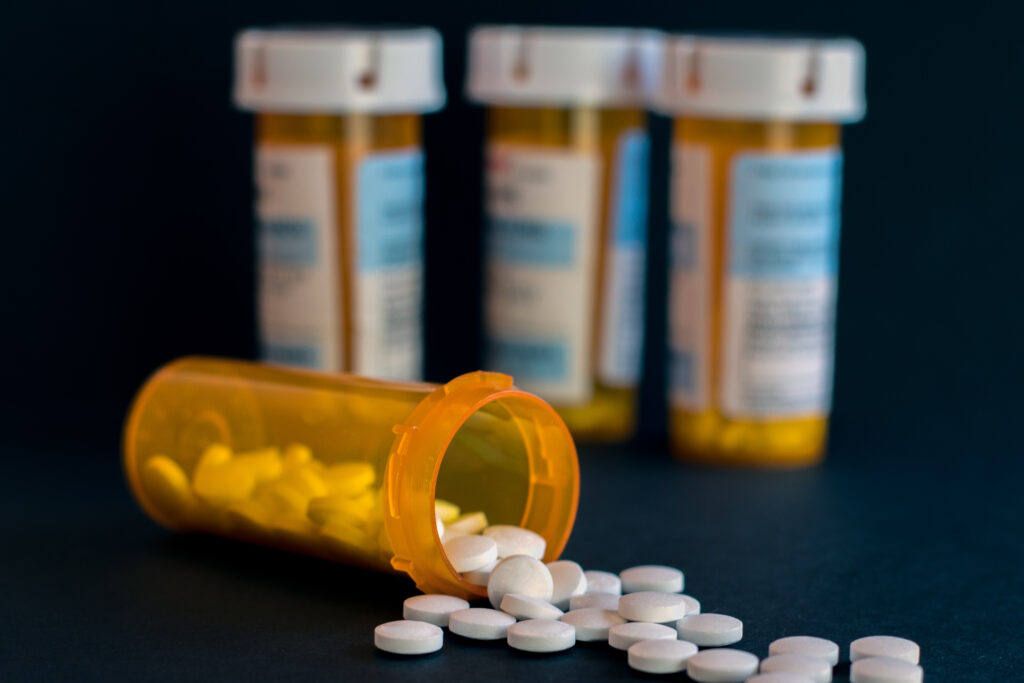 Four pharmacy bottles of Percocet representing the difficulty of Percocet detox.