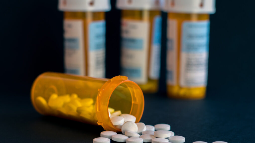 Four pharmacy bottles of Percocet representing the difficulty of Percocet detox.