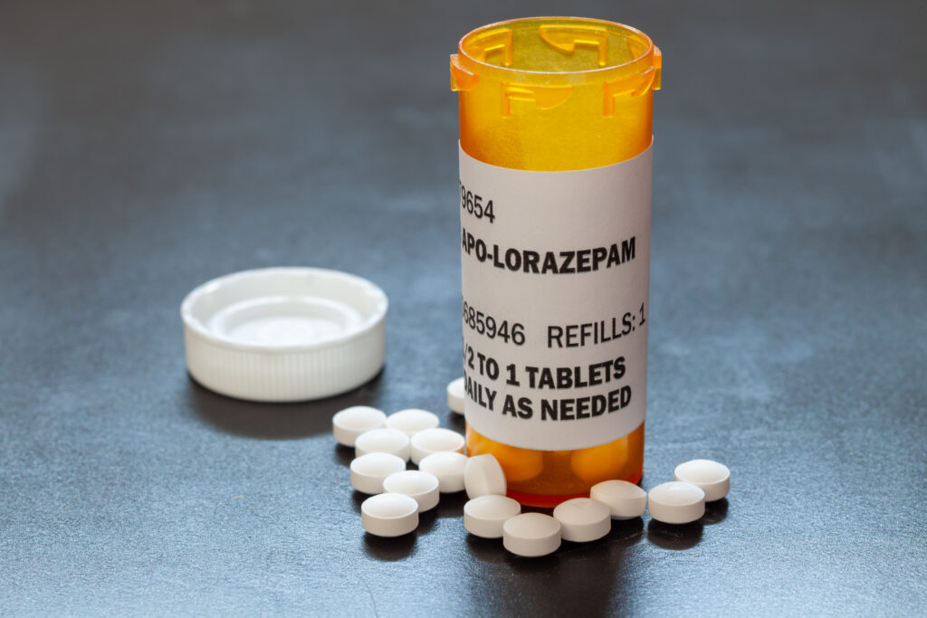 A pharmacy bottle of lorazepam is open with pills spilled out represents how many tablets can cause lorazepam withdrawal.