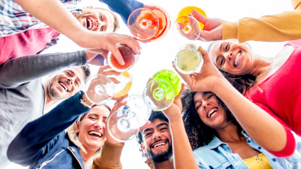 A group of young people hanging out together represents the relationship between gen z and alcohol.