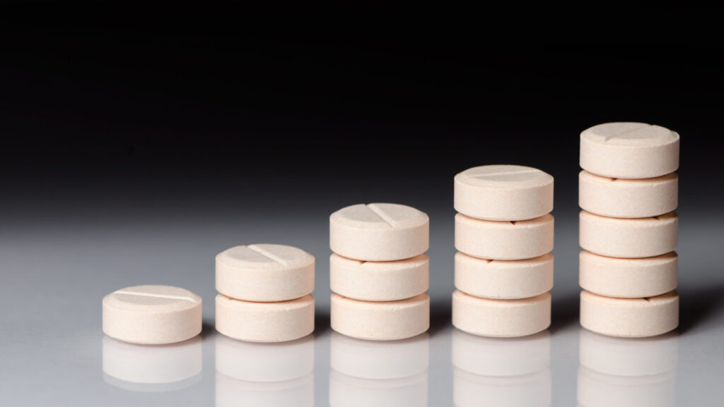 Various piles of pills representing taper medications that can help with substance use disorder treatment.