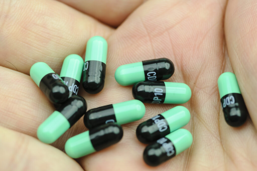 Black and green Librium tablets which are also part of a Librium taper treatment.