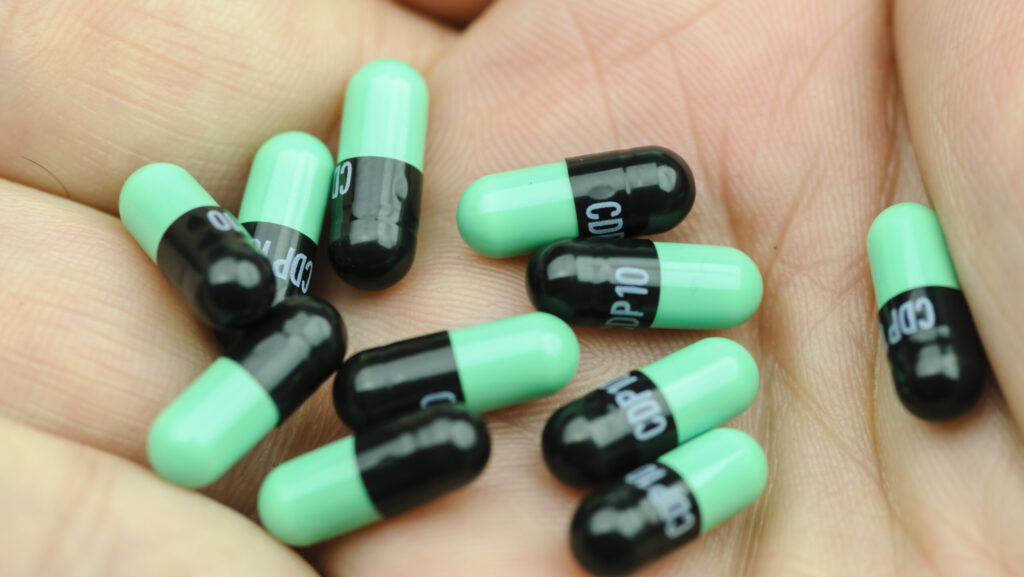 Black and green Librium tablets which are also part of a Librium taper treatment.