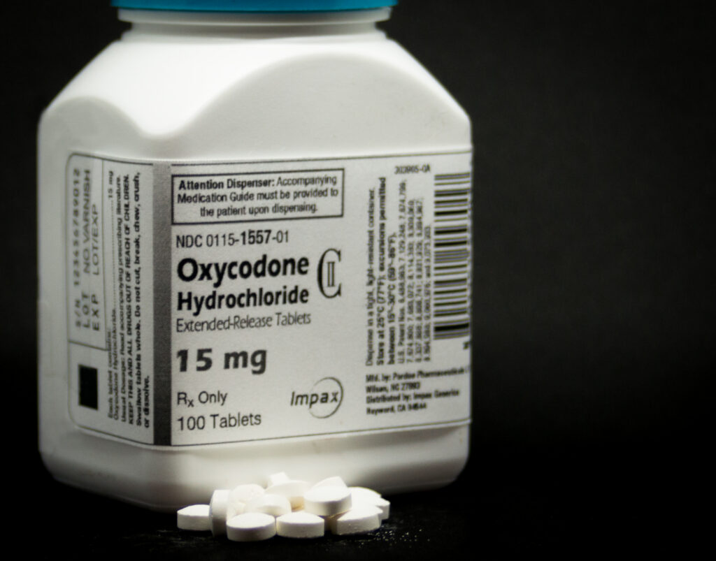 A pharmacy bottle of oxycodone represents how long does it take for oxycodone to kick in.