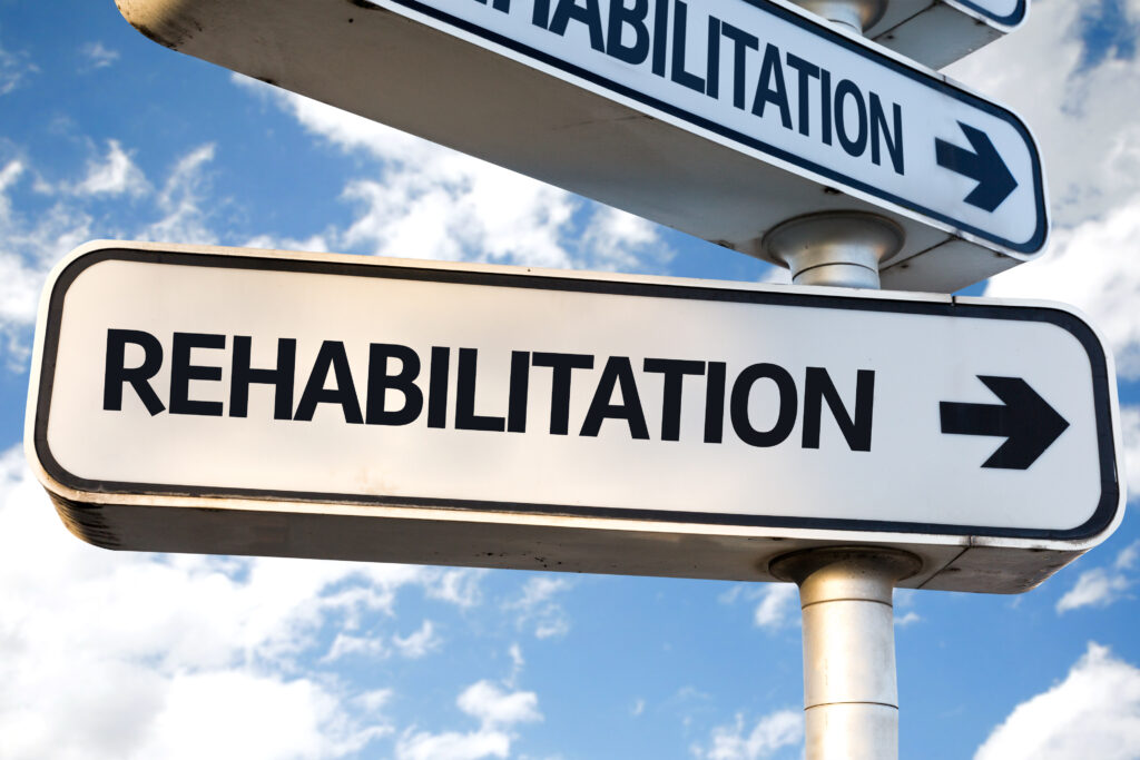A street signs that says rehabilitation represents drug rehab, where many question how long does drug rehab last?