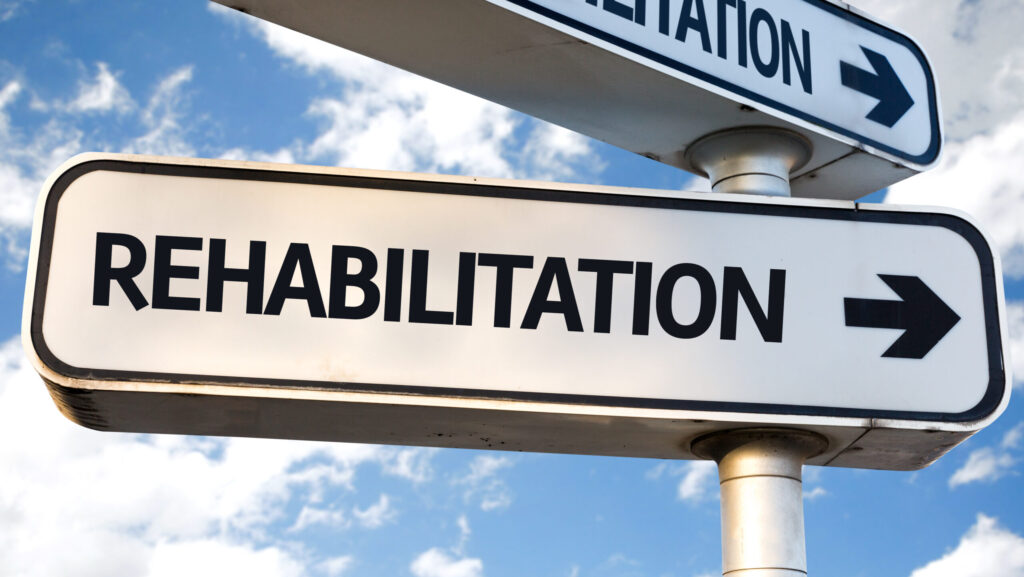 A street signs that says rehabilitation represents drug rehab, where many question how long does drug rehab last?