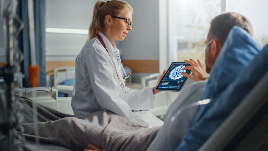 A female doctor explaining to male patient about the brain recovery from alcohol timeline.