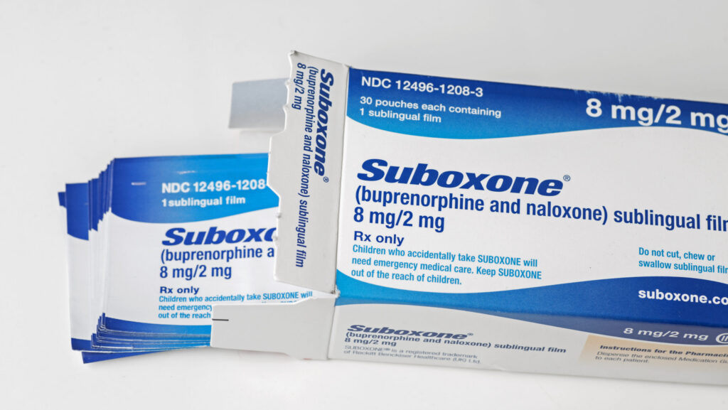 A prescription box of Suboxone sublingual films shows how long Suboxone can last in the system.