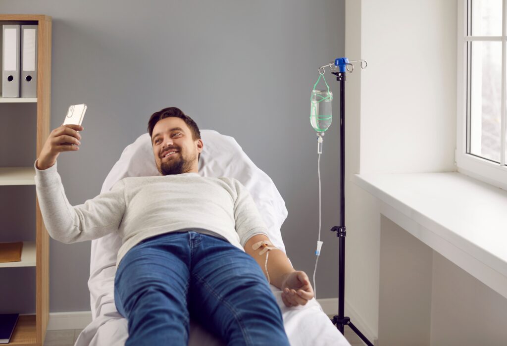 A man laying down in a clinic in a medical detox service in the United States.
