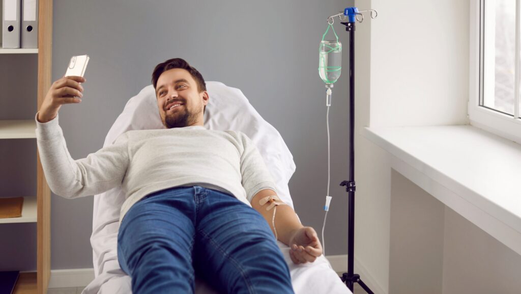 A man laying down in a clinic in a medical detox service in the United States.