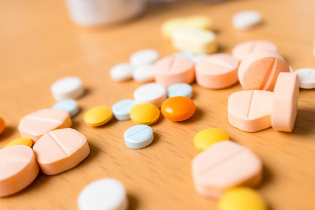 Various antidepressant pills on a table that can lead to symptoms similar to prozac withdrawals.